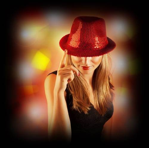 Sexy blonde with red hat in light show