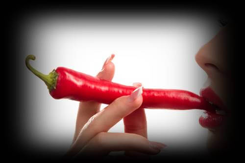 A woman eating chilli